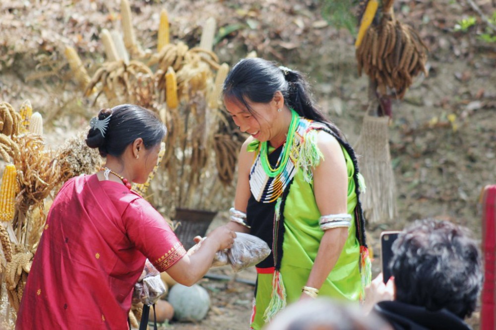 A woman farmer from East Khasi Hills, Meghalaya, exchanges seeds with a woman farmer from Mesulumi village, Nagaland at Biodiversity Festival on March 8.
